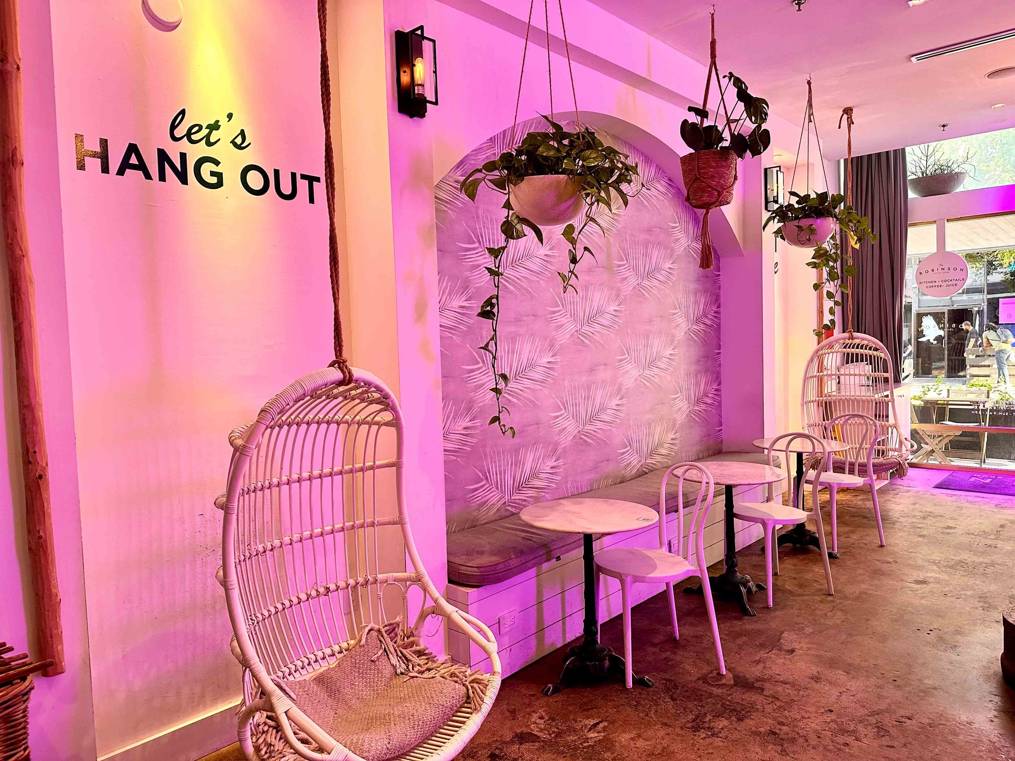 hammock with white decor and pink lighting